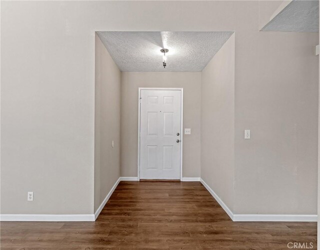 17702 Hinton St, Hesperia, CA 92345 - foyer entrance featuring wood finished floors and a textured ceiling