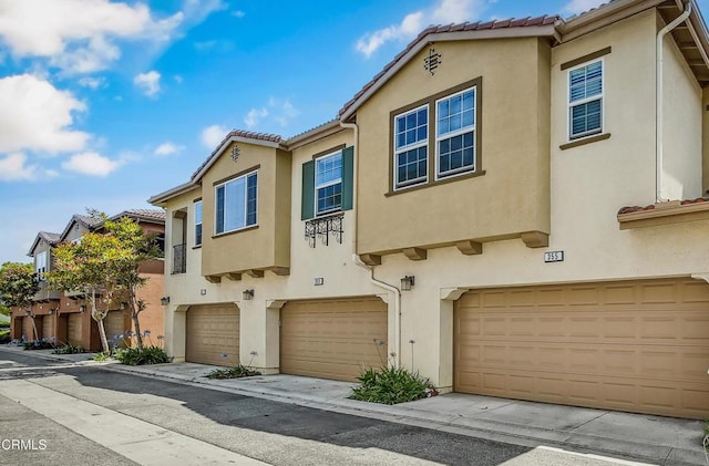 353 American River Ct, Oxnard, CA 93036 - multi unit property with stucco siding, a garage, and a tile roof