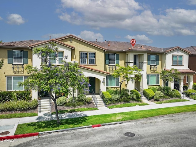 353 American River Ct, Oxnard, CA 93036 - multi unit property with a tiled roof, stucco siding, and stairway