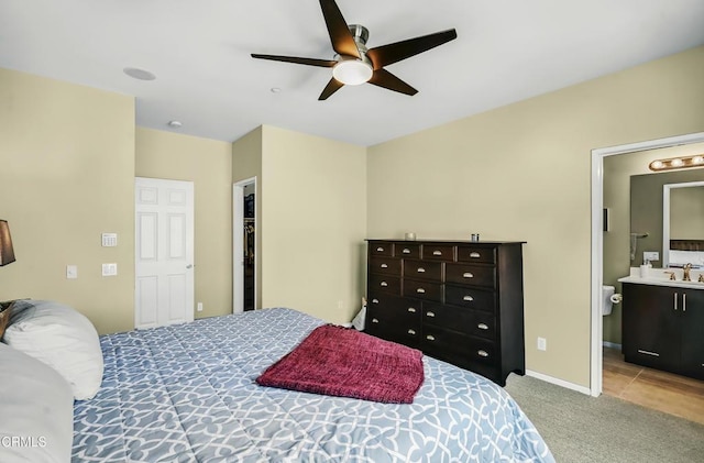 353 American River Ct, Oxnard, CA 93036 - carpeted bedroom with ceiling fan and connected bathroom