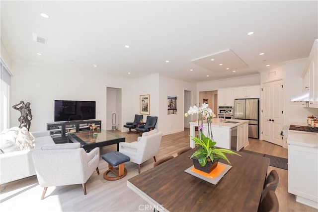 50 Tollson, Irvine, CA 92620 - dining area featuring light wood-style floors and recessed lighting