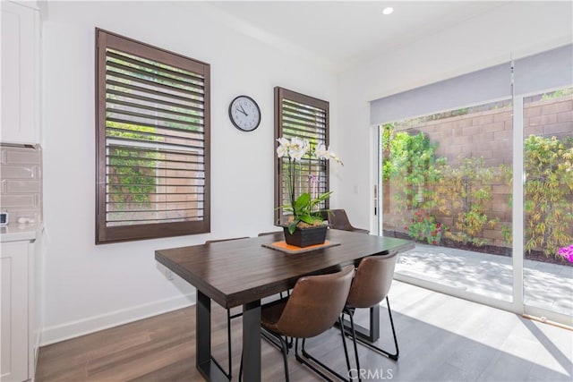 50 Tollson, Irvine, CA 92620 - dining area with dark wood-type flooring and crown molding