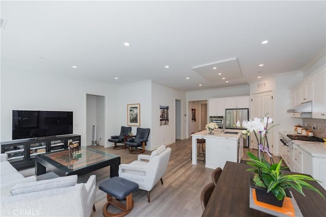 50 Tollson, Irvine, CA 92620 - living room with light wood-type flooring and recessed lighting