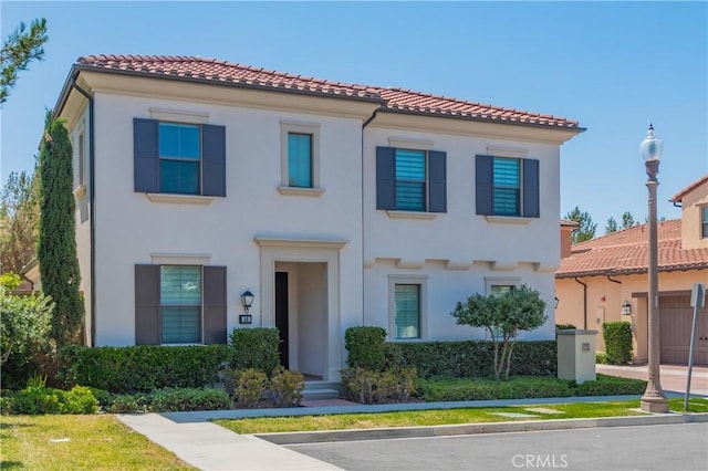 50 Tollson, Irvine, CA 92620 - view of front facade featuring a tile roof and stucco siding