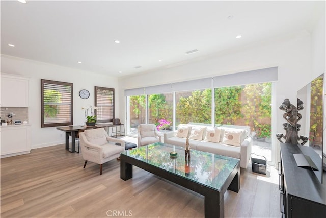 50 Tollson, Irvine, CA 92620 - living room with light wood-style flooring and recessed lighting