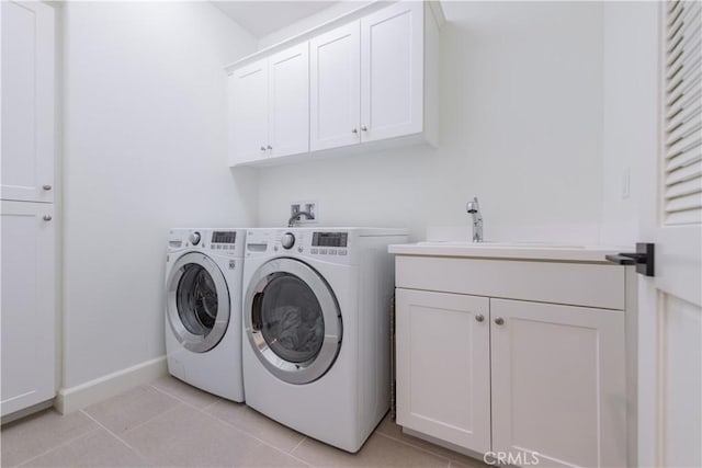 50 Tollson, Irvine, CA 92620 - laundry area with cabinet space, washer and dryer, and light tile patterned floors