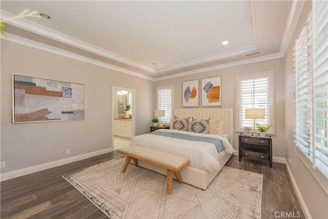 201 Bancroft, Irvine, CA 92620 - bedroom featuring dark wood finished floors, ornamental molding, a raised ceiling, connected bathroom, and recessed lighting