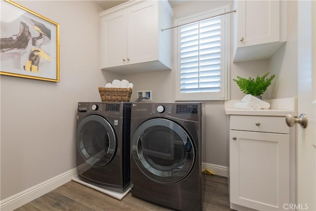 201 Bancroft, Irvine, CA 92620 - laundry room featuring cabinet space, washer and dryer, and wood finished floors