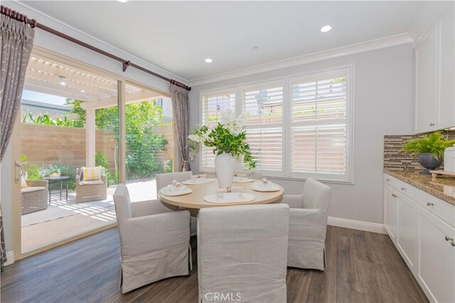 201 Bancroft, Irvine, CA 92620 - dining area with crown molding, dark wood-style floors, and recessed lighting