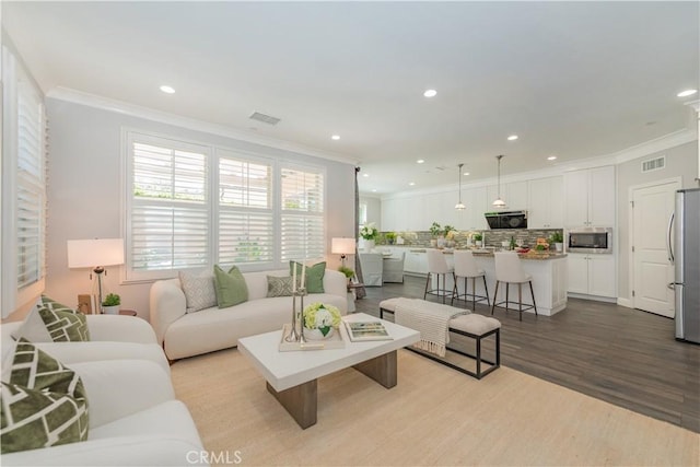 201 Bancroft, Irvine, CA 92620 - living room featuring crown molding, wood finished floors, and recessed lighting