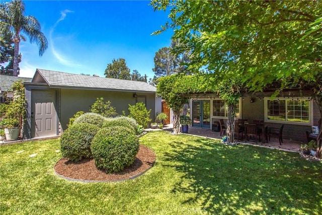 1107 Chestnut Ave, Redlands, CA 92373 - view of front facade featuring a front lawn, stucco siding, french doors, and a patio area