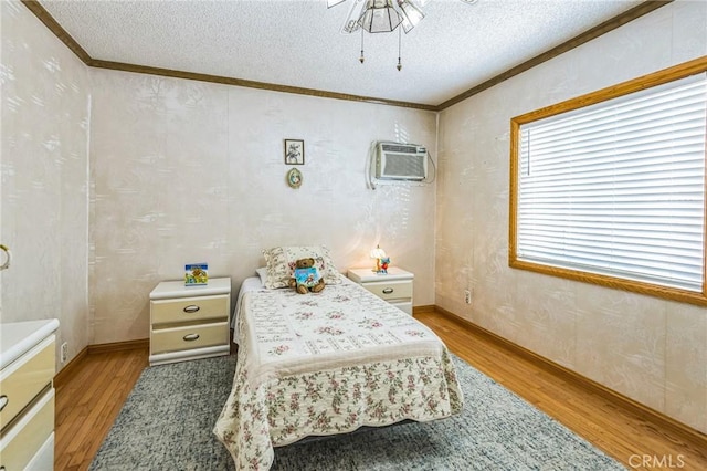 5437 Norwich Ave, Los Angeles, CA 90032 - bedroom with light wood-style floors, an AC wall unit, a textured ceiling, and ornamental molding