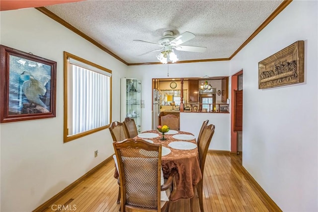 5437 Norwich Ave, Los Angeles, CA 90032 - dining space with wood-type flooring, a textured ceiling, ceiling fan, and crown molding