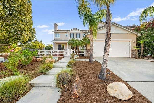 43611 Modena Dr, Temecula, CA 92592 - traditional-style house with stucco siding, a garage, concrete driveway, and a chimney