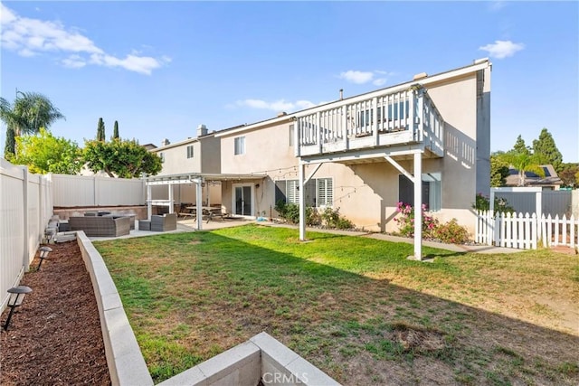43611 Modena Dr, Temecula, CA 92592 - rear view of property featuring a fenced backyard, outdoor lounge area, stucco siding, and a patio