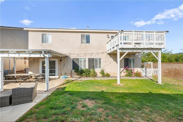 43611 Modena Dr, Temecula, CA 92592 - rear view of house with stucco siding, a deck, and a patio