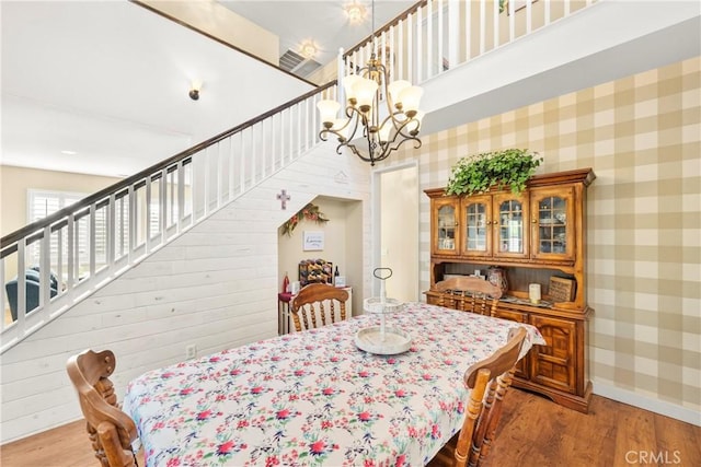 43611 Modena Dr, Temecula, CA 92592 - dining room with stairs, wood finished floors, and a chandelier