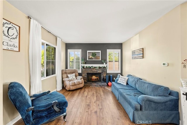 43611 Modena Dr, Temecula, CA 92592 - living area featuring wood finished floors and a fireplace