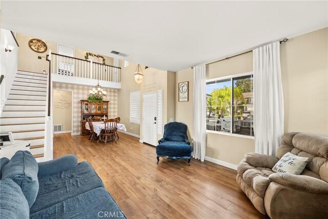 43611 Modena Dr, Temecula, CA 92592 - living area featuring wood finished floors and stairs