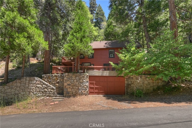 425 Blue Jay Canyon Rd, Blue Jay, CA 92317 - chalet / cabin with driveway, a garage, and a deck