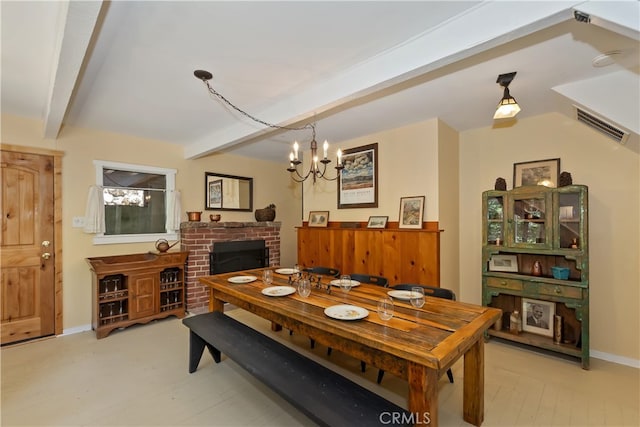 425 Blue Jay Canyon Rd, Blue Jay, CA 92317 - dining room featuring beamed ceiling, a chandelier, light wood finished floors, and a brick fireplace
