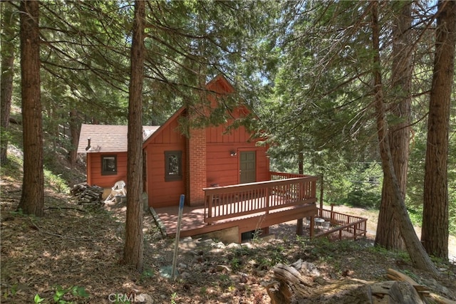 425 Blue Jay Canyon Rd, Blue Jay, CA 92317 - rear view of property with a deck and board and batten siding