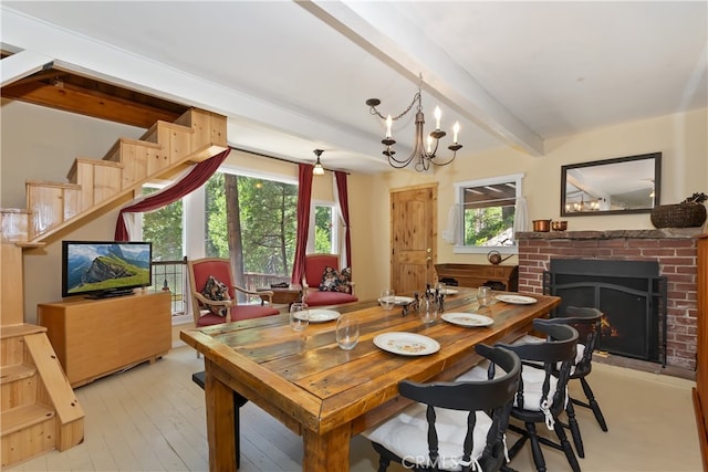 425 Blue Jay Canyon Rd, Blue Jay, CA 92317 - dining space featuring beamed ceiling, a fireplace, a chandelier, and light wood finished floors