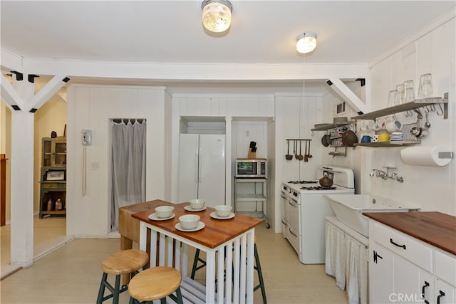 425 Blue Jay Canyon Rd, Blue Jay, CA 92317 - kitchen with white appliances, white cabinets, and light wood-type flooring
