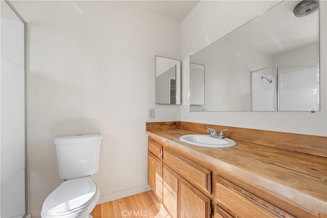 14526 Hardtree Dr, Lake Hughes, CA 93532 - bathroom featuring vanity, wood finished floors, and a shower