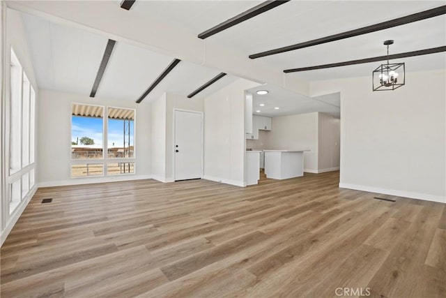 4369 Amador Rd, Phelan, CA 92371 - unfurnished living room featuring a chandelier, light wood-type flooring, and recessed lighting