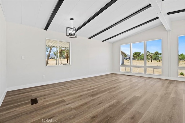 4369 Amador Rd, Phelan, CA 92371 - spare room featuring healthy amount of natural light, a chandelier, and wood finished floors