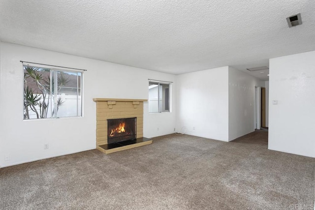 1608 Grandview St, Oceanside, CA 92054 - unfurnished living room featuring carpet, a fireplace, and a textured ceiling