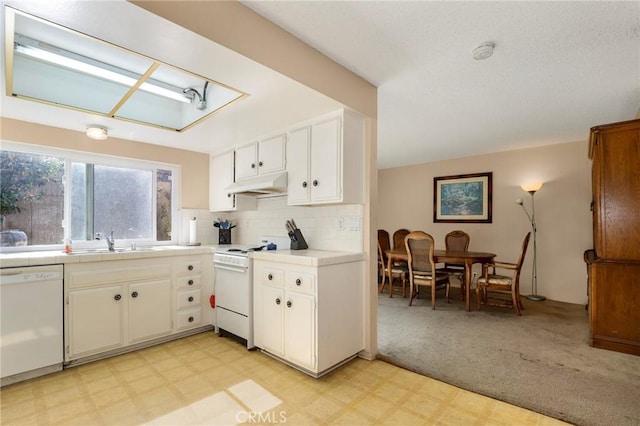 4161 Elizabeth Ct, Cypress, CA 90630 - kitchen with white appliances, under cabinet range hood, light floors, and white cabinets