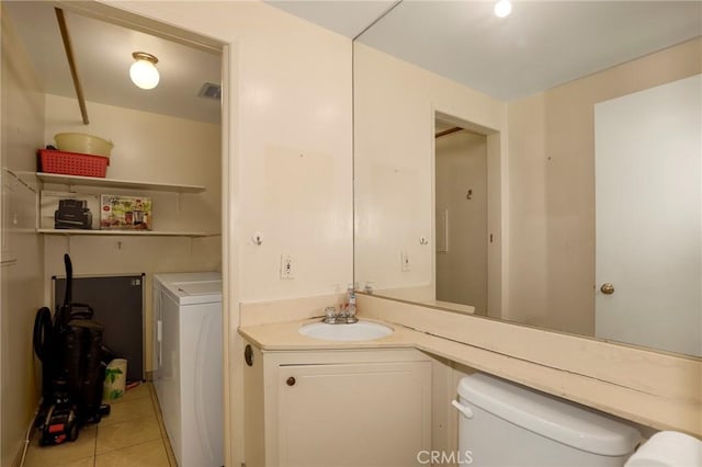 4161 Elizabeth Ct, Cypress, CA 90630 - half bath with tile patterned flooring, vanity, and washer and dryer