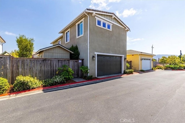 316 Junipero Way, San Luis Obispo, CA 93401 - view of property exterior featuring stucco siding and a garage