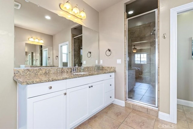 316 Junipero Way, San Luis Obispo, CA 93401 - bathroom with vanity, a stall shower, tile patterned flooring, plenty of natural light, and recessed lighting