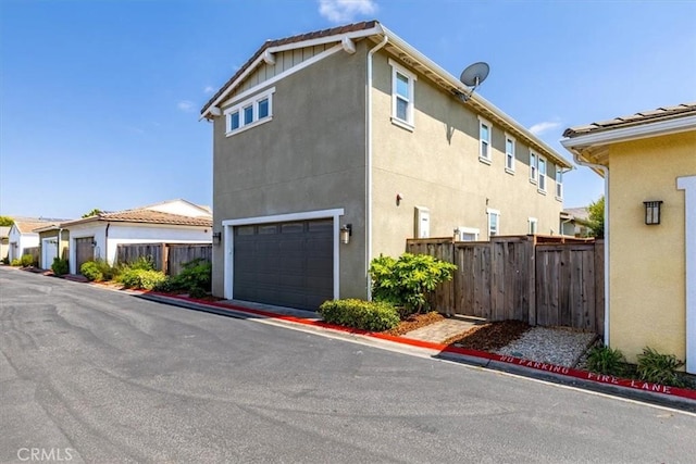 316 Junipero Way, San Luis Obispo, CA 93401 - view of side of property featuring stucco siding and a garage