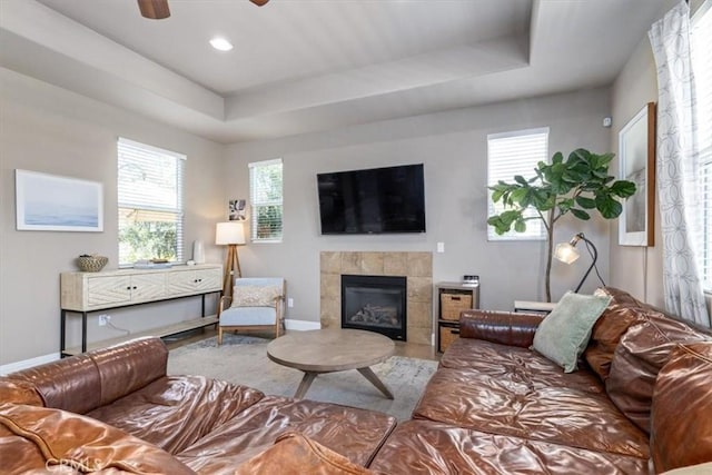 316 Junipero Way, San Luis Obispo, CA 93401 - living area featuring a tray ceiling, a ceiling fan, a tile fireplace, recessed lighting, and wood finished floors