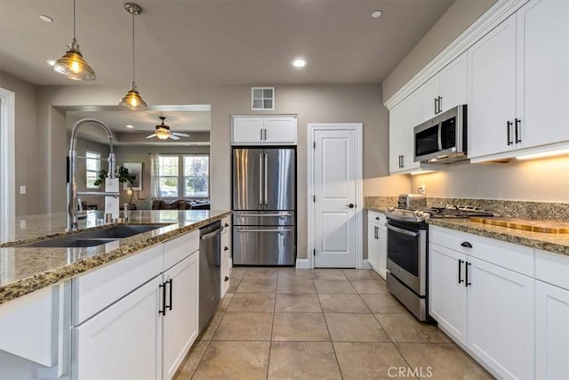 316 Junipero Way, San Luis Obispo, CA 93401 - kitchen with appliances with stainless steel finishes, recessed lighting, white cabinetry, ceiling fan, and decorative light fixtures