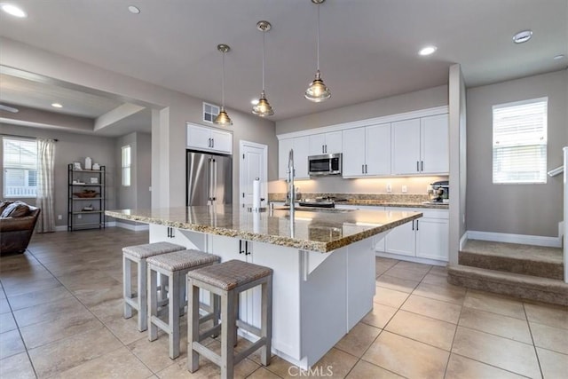 316 Junipero Way, San Luis Obispo, CA 93401 - kitchen with appliances with stainless steel finishes, light tile patterned flooring, plenty of natural light, light stone counters, and recessed lighting