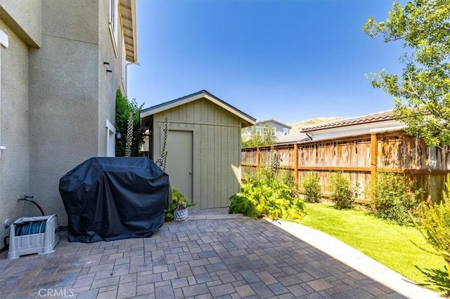 316 Junipero Way, San Luis Obispo, CA 93401 - fenced backyard with a patio area, a shed, and grilling area