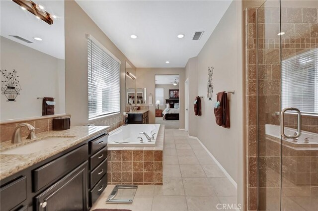 28089 Promontory Ln, Valencia, CA 91354 - bathroom featuring vanity, a bath, a stall shower, tile patterned flooring, and ensuite bathroom