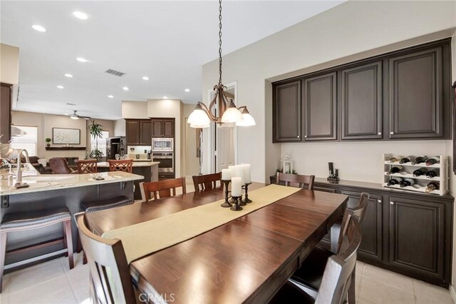 28089 Promontory Ln, Valencia, CA 91354 - dining area with light tile patterned flooring, a chandelier, and recessed lighting