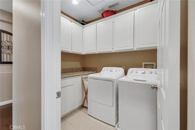 28089 Promontory Ln, Valencia, CA 91354 - laundry area with cabinet space and washing machine and dryer