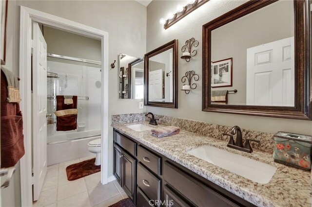 28089 Promontory Ln, Valencia, CA 91354 - bathroom featuring double vanity, tile patterned floors, and bath / shower combo with glass door