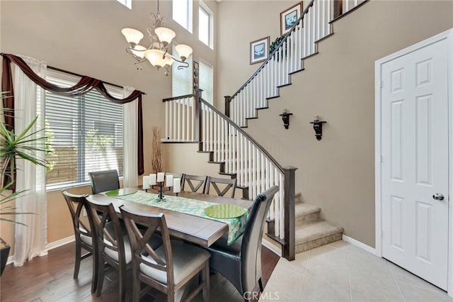 28089 Promontory Ln, Valencia, CA 91354 - dining area featuring stairway, a chandelier, and a towering ceiling