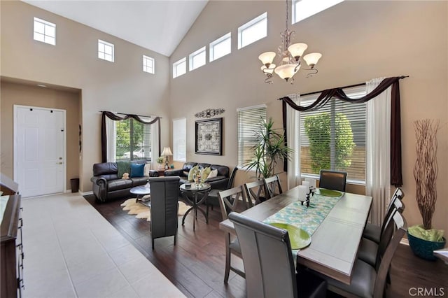 28089 Promontory Ln, Valencia, CA 91354 - dining area featuring a chandelier, high vaulted ceiling, and wood finished floors