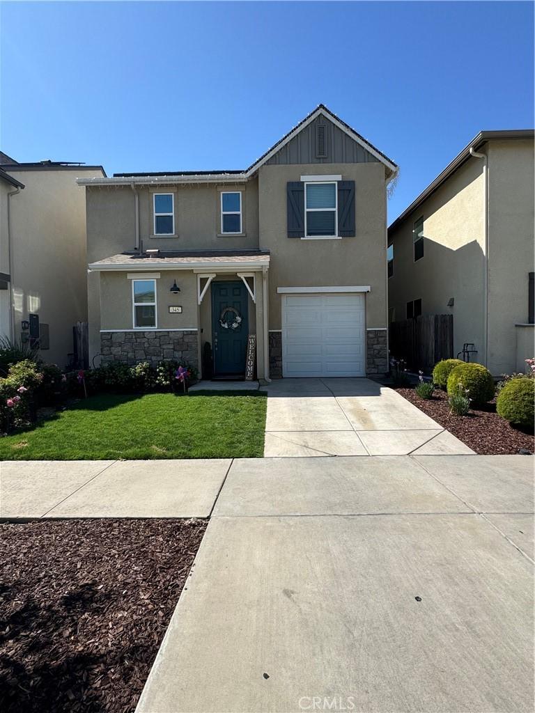 345 Sullivan Dr, Merced, CA 95348 - traditional-style home featuring stone siding, stucco siding, driveway, and an attached garage