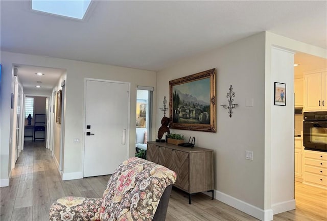 2148 Ronda Granada Unit A, Laguna Woods, CA 92637 - foyer entrance with light wood-type flooring and baseboards