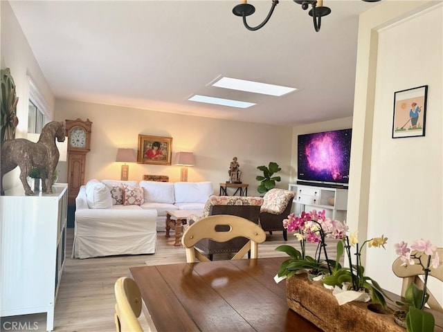 2148 Ronda Granada Unit A, Laguna Woods, CA 92637 - living room with a skylight and light wood-style floors